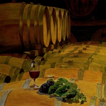 Verre de vin et grappe de raisin sur tonneaux